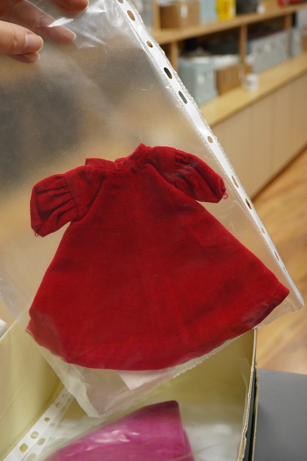 A 1960's Mattel Inc. Barbie doll, 1963, together with a Skipper doll, and a collection of eight original outfits with accessories, sorted into individual packets, outfits purchased between 1963 to 1966 include; American